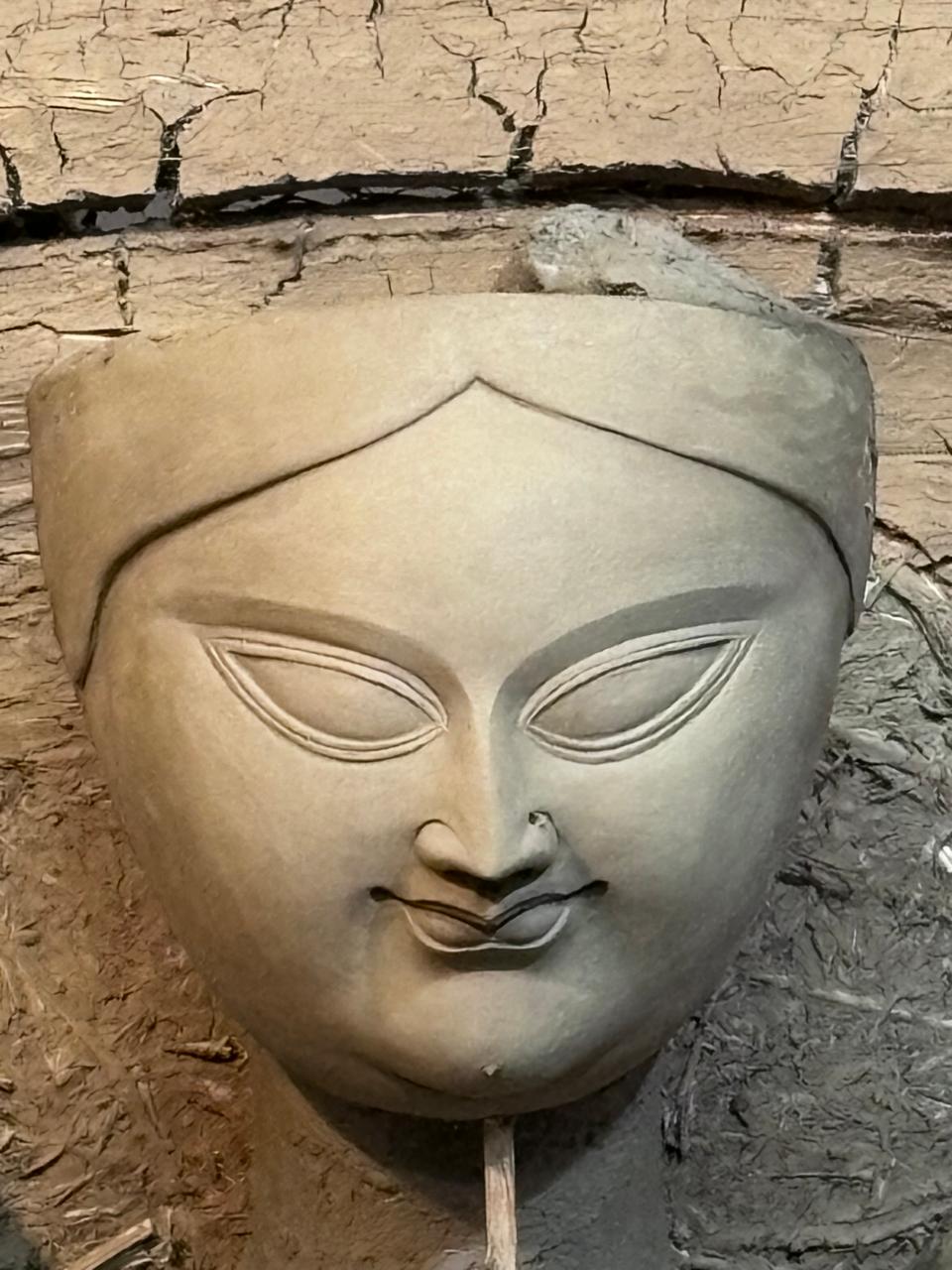 Clay face of the Durga idol being shaped