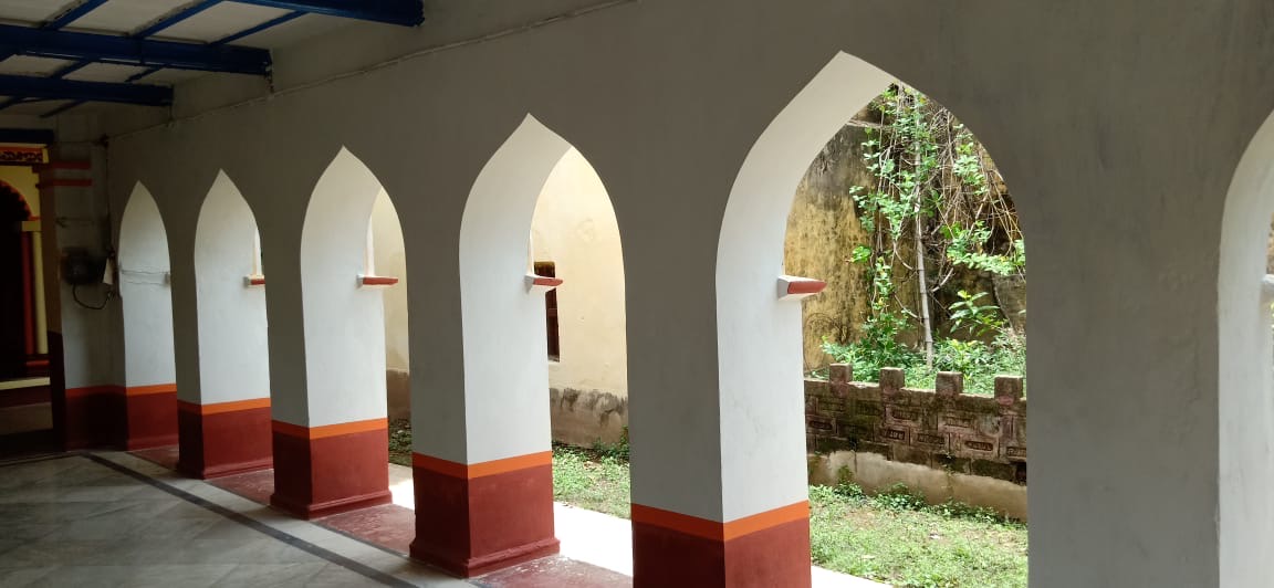 Sunlit arched corridor of the heritage homestay