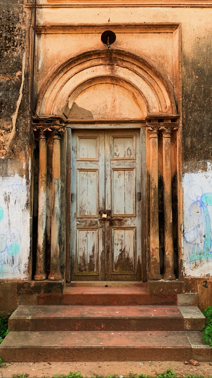 Weathered arched doorway at Amadpur